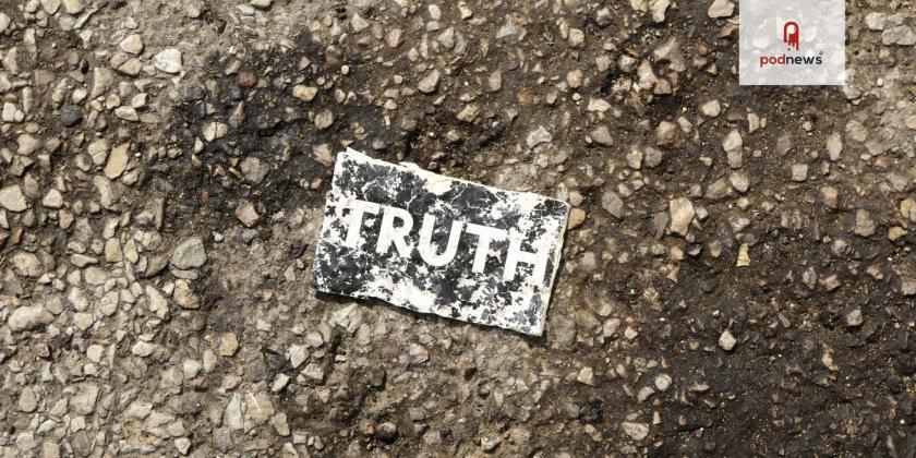 A card saying 'truth', on the ground of a parking lot, just outside Chicago. It has been driven over.